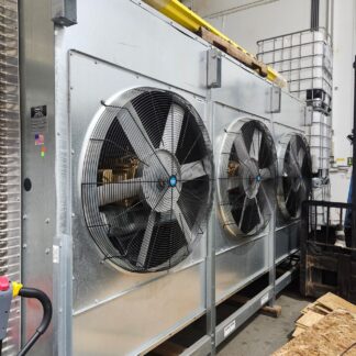 Industrial cooling system with three large fans in a metal housing inside a warehouse.