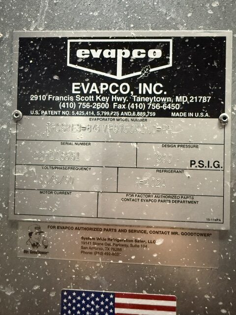Metal nameplate on an industrial evaporator labeled Evapco, with serial number, design pressure, volts/frequency, refrigerant, motor current, and a US flag sticker.