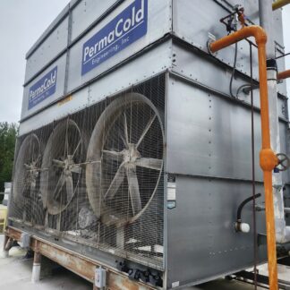 Industrial cooling unit with three large fans behind a metal mesh, labeled Permacold Engineering; orange pipes run along the side.
